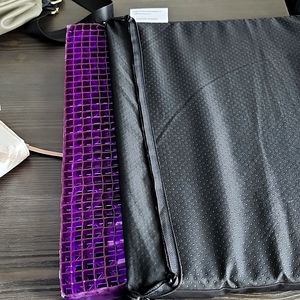 Purple seat cushion for use in restaurants, cars.  It make sitting more comfy.